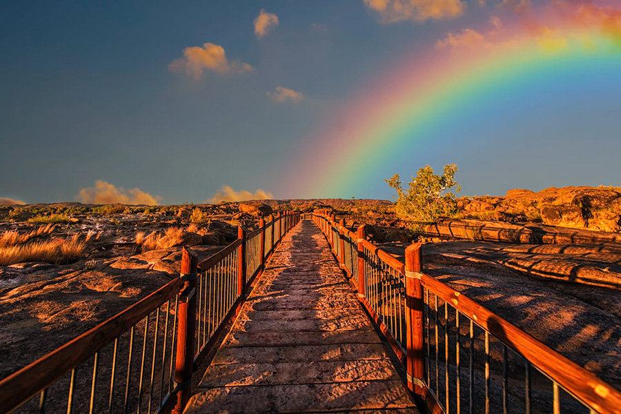 at - a sign rainbow